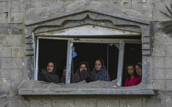 Palestinians look at the destruction after an Israeli airstrike on a crowded tent camp housing Palestinians displaced by the war in Muwasi, Gaza Strip, Sept. 10, 2024.