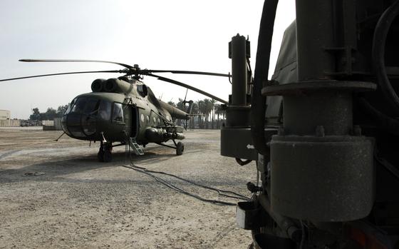 A Mi-8 Russian Helicopter is charging its batteries before a mission on Camp Echo, Iraq, Jan. 21, 2008. (U.S. Army Photo/Spc. Alan Moos)