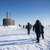 240316-N-EI510-1703 BEAUFORT SEA, Arctic Circle (March 16, 2024) – Chief of Naval Operations Adm. Lisa Franchetti walks with other distinguished visitor towards the Virginia-class fast-attack submarine USS Indiana (SSN 789) before embarking Indiana during Operation Ice Camp (ICE CAMP) 2024. ICE CAMP is a three-week operation that allows the Navy to assess its operational readiness in the Arctic, increase experience in the region, advance understanding of the Arctic environment, and continue to develop relationships with other services, allies, and partner organizations. (U.S. Navy photo by Mass Communication Specialist 1st class Scott Barnes)