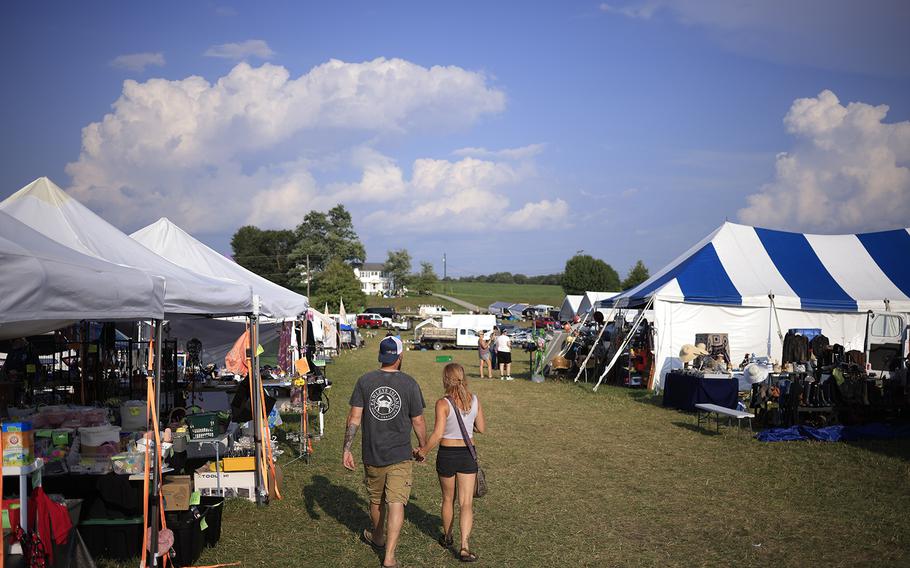 Shoppers walk through a vendor stop during the U.S. 127 Yard Sale on Aug. 2 in Harrodsburg, Ky. 