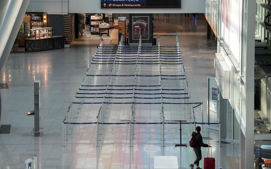 The check-in area is empty at the airport in Duesseldorf, Germany.