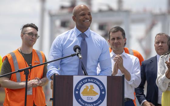 Maryland's Governor Wes Moore, second from left, speaks during a press conference to mark the full reopening of the Port of Baltimore after the collapse of the Francis Scott Key Bridge in March, Wednesday, June 12, 2024, at the Port of Baltimore in Dundalk, Md. 
