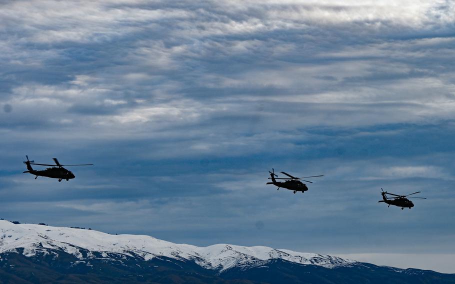 UH-60 Black Hawk helicopters fly in the sky