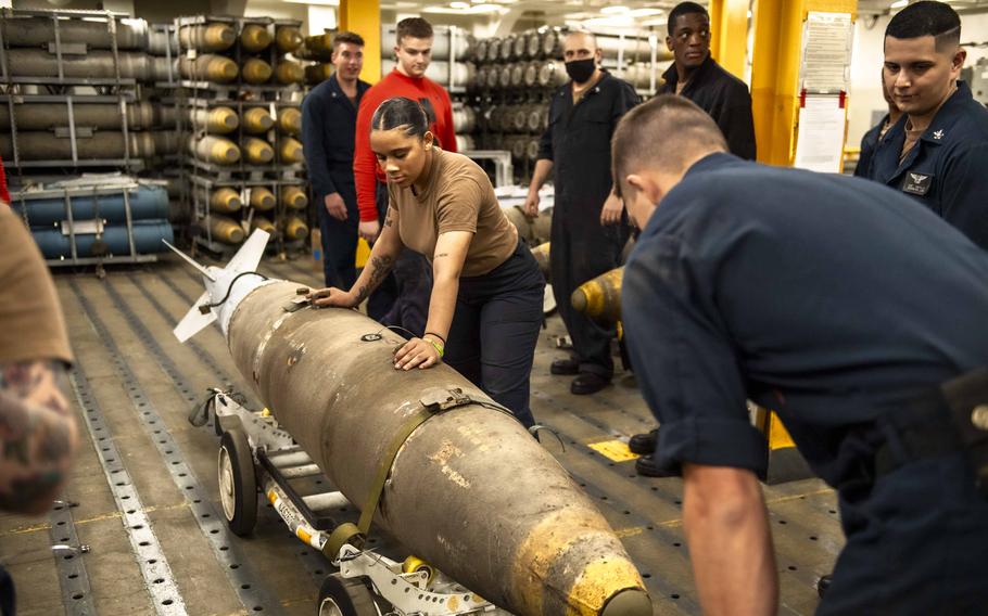 Sailors prepare ordnance for transport aboard the USS Dwight D. Eisenhower in the Red Sea on Feb. 2, 2024. 