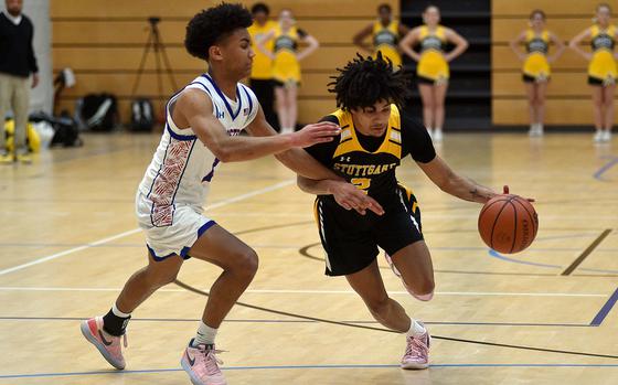 Ramstein guard Christian Roy harries Stuttgart ballhandler Adrian Anglada Paz during a Division I pool-play game at the 2025 DODEA European basketball championships on Feb. 13, 2025, at the Wiesbaden Sports and Fitness Center on Clay Kaserne in Wiesbaden, Germany.