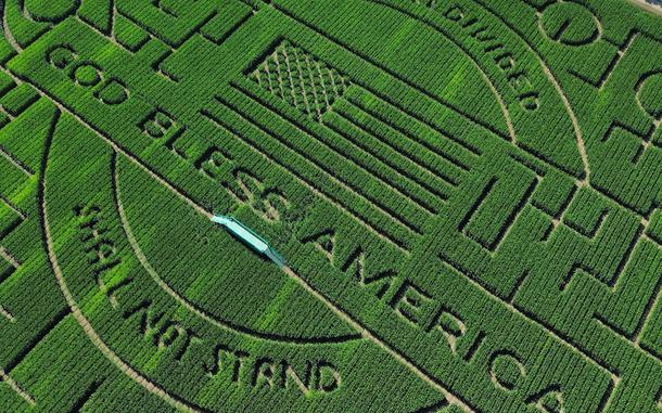 An aerial view of this year’s corn maze at Cool Patch Pumpkins in Dixon, Calif. It is one of the world’s largest — in 2023, according to Guinness World Records, a farmer in Quebec usurped Cool Patch Pumpkins for the title.  Each year the Cool Patch Pumpkins maze has a theme: This year, the words “A House Divided Shall Not Stand” are carved into the corn, along with “God Bless America.”