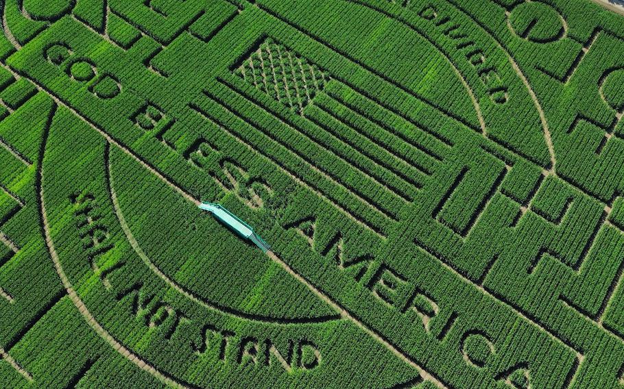 An aerial view of this year’s corn maze at Cool Patch Pumpkins in Dixon, Calif. It is one of the world’s largest — in 2023, according to Guinness World Records, a farmer in Quebec usurped Cool Patch Pumpkins for the title.  Each year the Cool Patch Pumpkins maze has a theme: This year, the words “A House Divided Shall Not Stand” are carved into the corn, along with “God Bless America.”