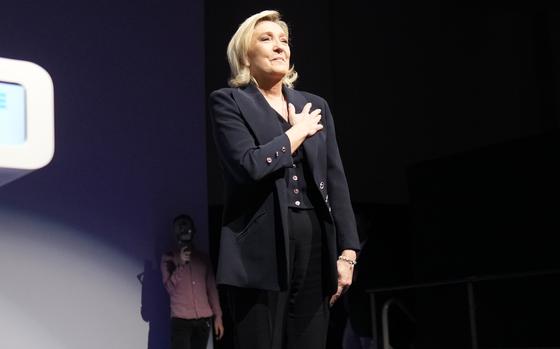 French far right leader Marine Le Pen gestures to supporters after a speech on June 30, 2024.