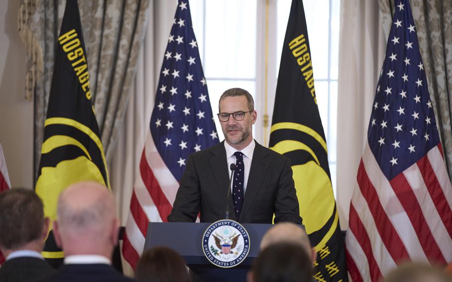 Adam Boehler speaks at an event at the State Department.