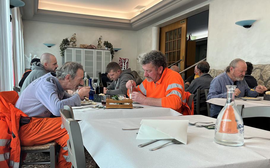 At Le Quattro Stagione in Longare, Italy, a sign out front says tables are reserved for workers. The casual restaurant is near the U.S. military bases Caserma Matteo Miotto and Caserma Ederle.