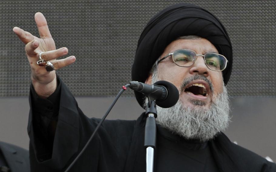 Hezbollah leader Sheik Hassan Nasrallah, speaks to the crowd in a rare public appearance during Ashura, that marks the death of Shiite Islam’s Imam Hussein, in the suburbs of Beirut, Nov. 14, 2013.