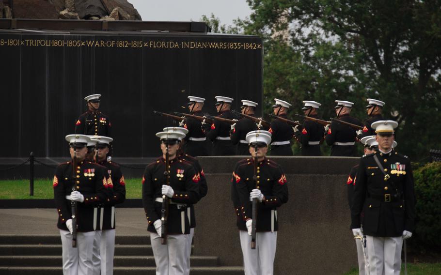 A firing party with Bravo Company, fires a volley during a Sunset Parade at the Marine Corps War Memorial, Arlington, Va., July 23, 2024.