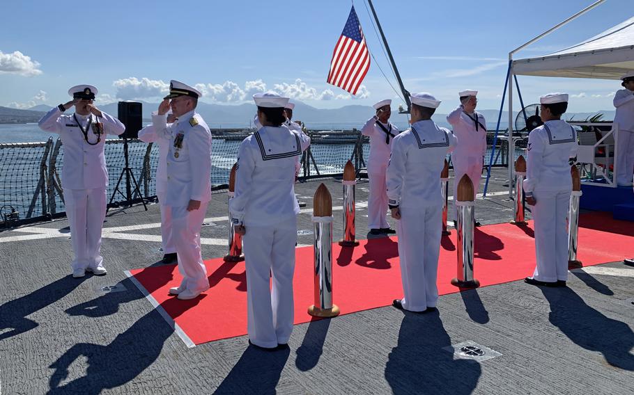 Vice Adm. Thomas Ishee is saluted by sailors as he departs a change of command ceremony aboard the USS Mount Whitney in Naples, Italy, on Sept. 24, 2022.