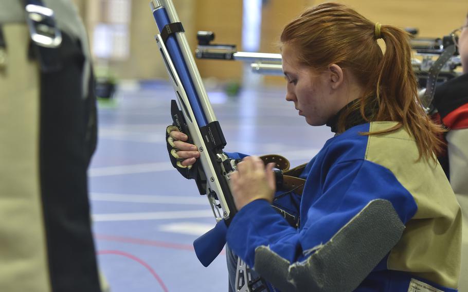 Amicary Farrer reloads her rifle.