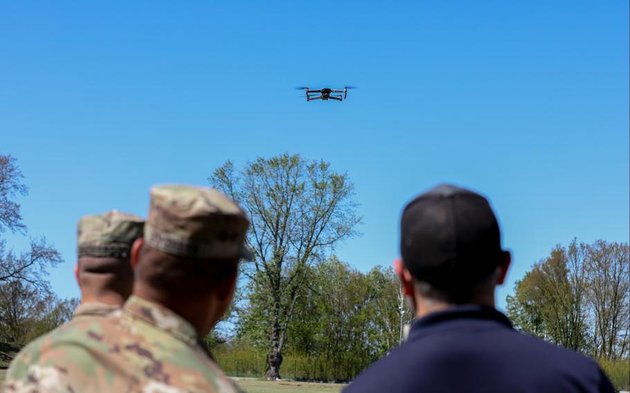 Soldiers with the 1st Cavalry Division watch as a drone approaches during Dronebuster training in Boleslawiec, Poland, on May 14, 2024.