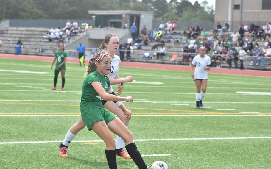 Naples freshman Hayden Medford quickly boots the ball in the net after cleaning up a Vicenza mistake right in front of the goal Thursday, May 23, 2024, at the DODEA European Division II girls soccer championship at Ramstein High School in Germany.