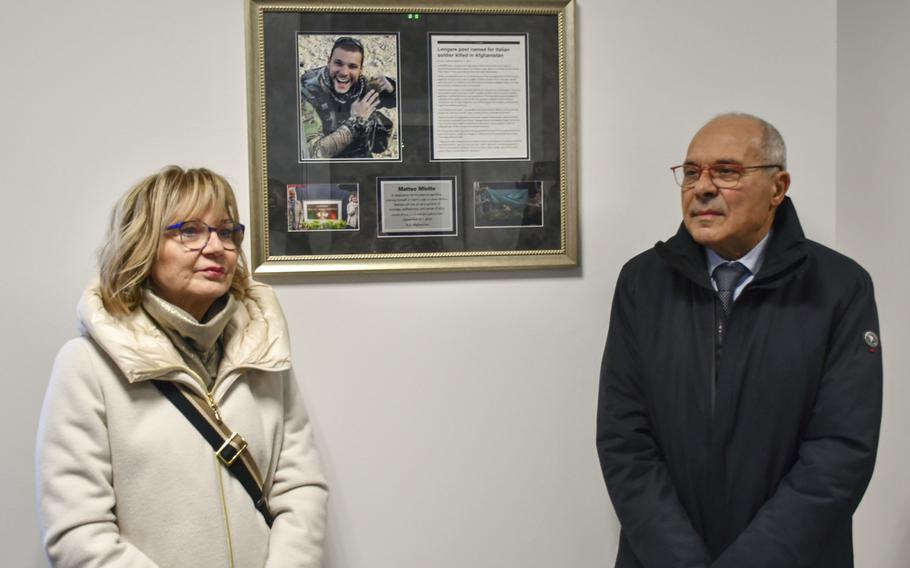 Anna Dal Farro and Franco Miotto, the parents of Matteo Miotto, stand in front of a plaque at Caserma Matteo Miotto in Longare, Italy, on Jan. 24, 2025. The U.S. Army base is named after the 24-year-old Italian soldier, who was killed in Afghanistan in 2010.