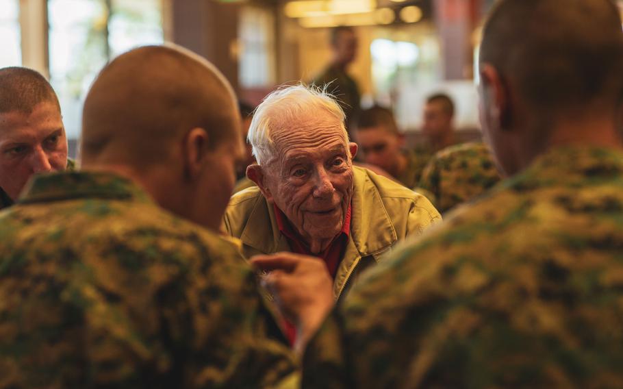 Veteran Don Graves speaks to new Marines during breakfast