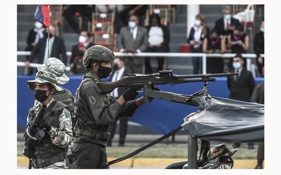 Members of Venezuela's army aboard a tank during a military parade marking the 210th anniversary of the independence of Venezuela on July 5, 2021, in Caracas, Venezuela. Caracas was recently named the riskiest city in the world to visit by Forbes Advisor. (Carolina Cabral/Getty Images/TNS)