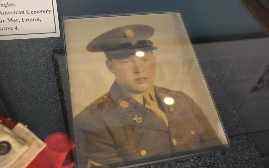 A portrait of Pfc. Charles Fizer on display at the Bedford Boys Tribute Center in Bedford, Va., on May 11, 2024. Fizer, 22, was killed in action on July 11, 1944. He was one of 20 soldiers from the town or county of Bedford from Company A of the 116th Infantry Regiment, 29th Division that died during the Normandy campaign. 