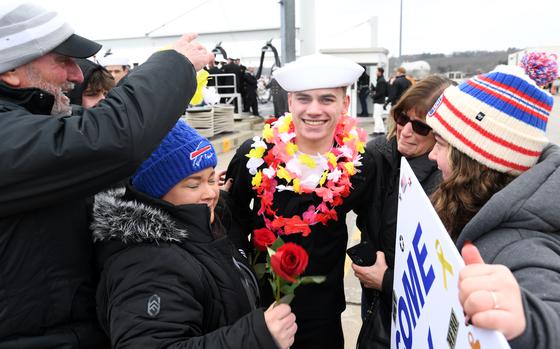 241220-N-GR655-1306 GROTON, Conn. (December 20, 2024) – A sailor, attached to the first-in-class fast-attack submarine USS Virginia (SSN 774), embraces his loved ones during a homecoming event at Naval Submarine Base New London in Groton, Connecticut, December 20, 2024. Virginia and crew operate under Submarine Squadron (SUBRON) 4, whose primary mission is to provide attack submarines that are ready, prepared, and committed to meet the unique challenges of undersea combat and deployed operations in unforgiving environments across the globe. (U.S. Navy photo by Chief Petty Officer Joshua Karsten)