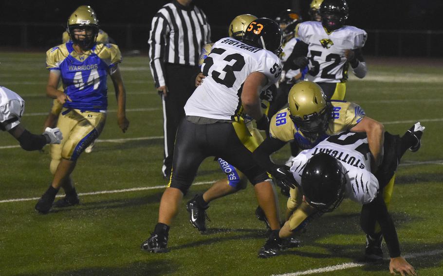 Wiesbaden senior Hunter Luneke tackles Stuttgart quaterback Kai Lewis in the second half of a game in Wiesbaden, Germany on Sept. 13, 2024.