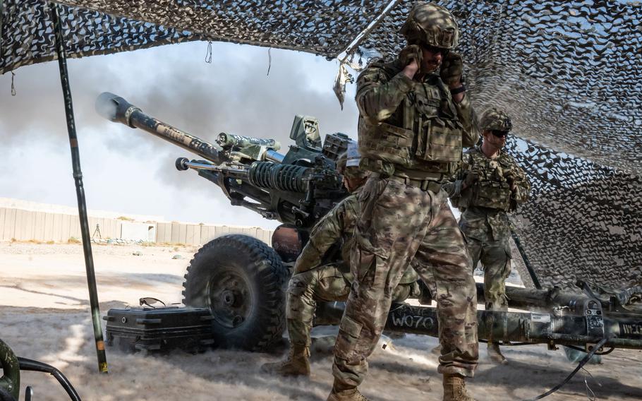 U.S. Army soldiers fire the M119A3 Howitzer during a joint artillery training exercise at al Asad Air Base, Iraq, on Oct. 26, 2023. Five U.S. service members and two American contractors were injured when two rockets struck the base Aug. 5, 2024, a defense official said on Aug. 6. 