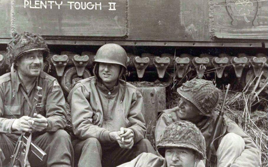 Col. Dorrance Roysdon of the 36th Infantry Regiment, left, Lt. Col. Samuel Hogan, Capt. Edwin Gunderson and Capt. Norbert Horrell of I Company, gather before an attack on Hill 91 near Pont-Hébert, France, in July 1944.