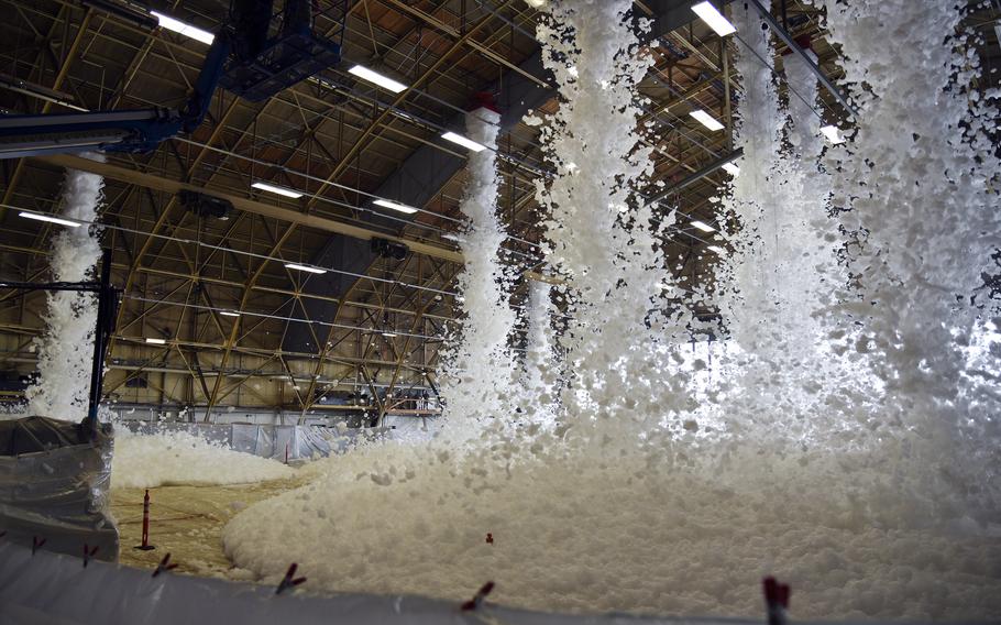 Aqueous firefighting foam falls from the ceiling.