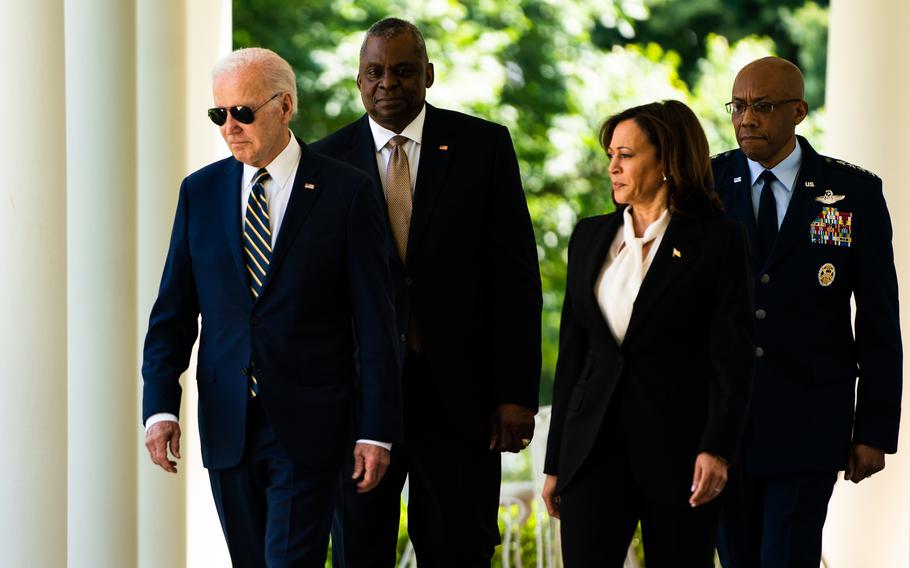 President Biden, accompanied from left to right by Defense Secretary Lloyd Austin, Vice President Harris and Gen. Charles Q. Brown Jr., outside the White House in May.