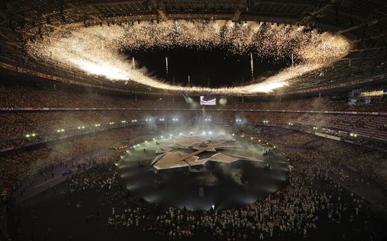 Fireworks ignite during the 2024 Summer Olympics closing ceremony at the Stade de France, Sunday, Aug. 11, 2024, in Saint-Denis, France. (AP Photo/Kin Cheung)