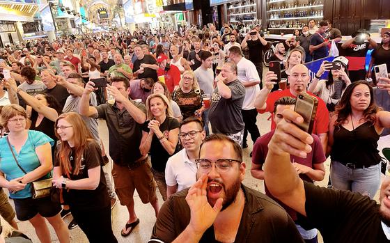 A crowd gathers at Las Vegas's Fremont Street area to watch a midnight concert celebrating the lifting of pandemic restrictions June 1.