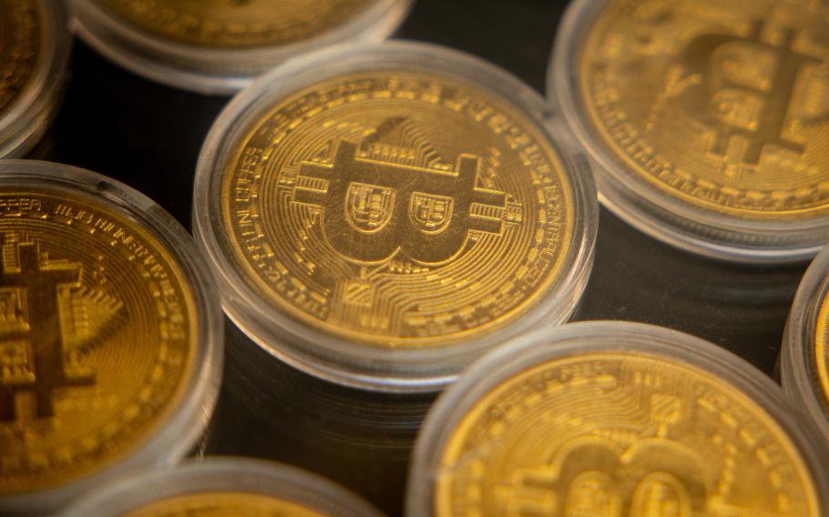 Gold Bitcoins are seen in the window of a Bitcoin and cryptocurrency exchange office on Nov. 8, 2024, in Istanbul, Turkey. (Chris McGrath/TNS)