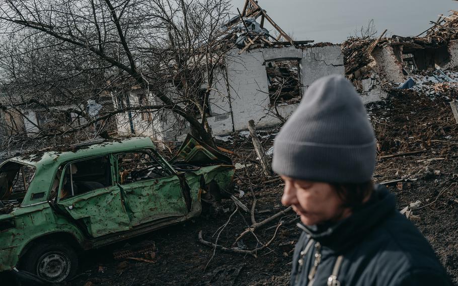 A woman walks on a devastated street in Novoselivka Persha, on the outskirts of Avdiivka, on Feb. 3. 