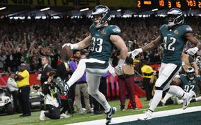 Philadelphia Eagles defensive back Cooper DeJean (33) scores a touchdown.