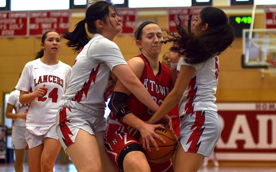 Elizabeth Marriott battles for the ball with Isabella Herman and Anabella Potenzone.