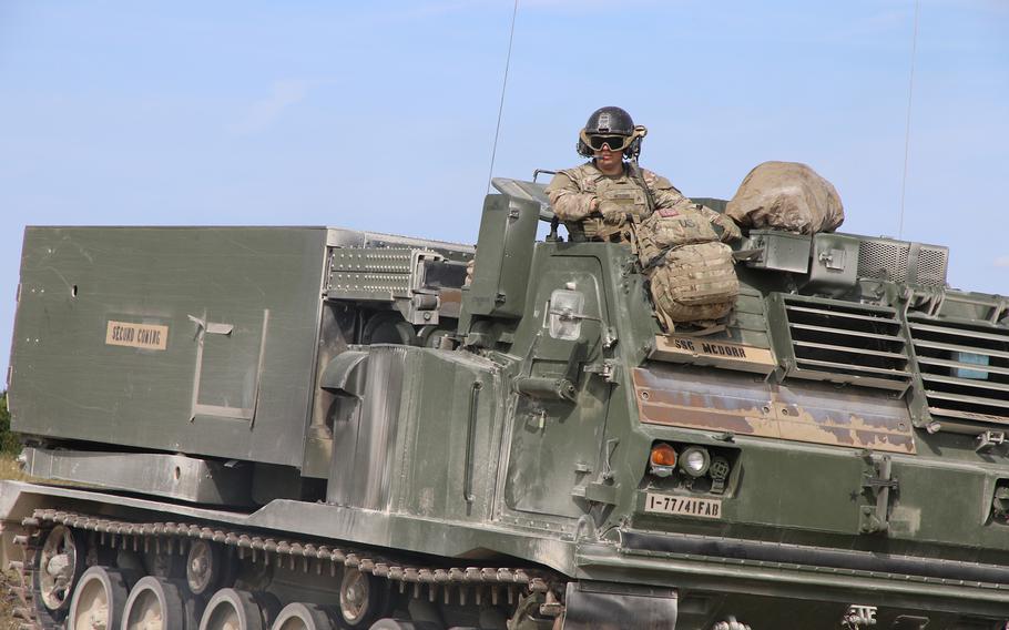 Army Staff Sgt. Shawn McDorr uses M270A1