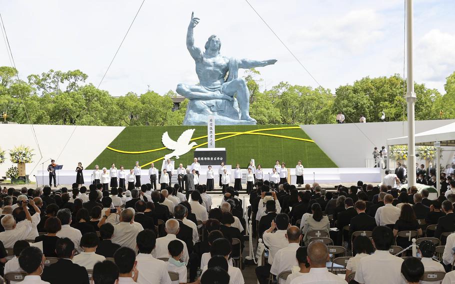 A choral group of atomic-bomb survivors performs in Nagasaki’s Peace Park to open a memorial ceremony on the 77th anniversary of the atomic bombing of the city.