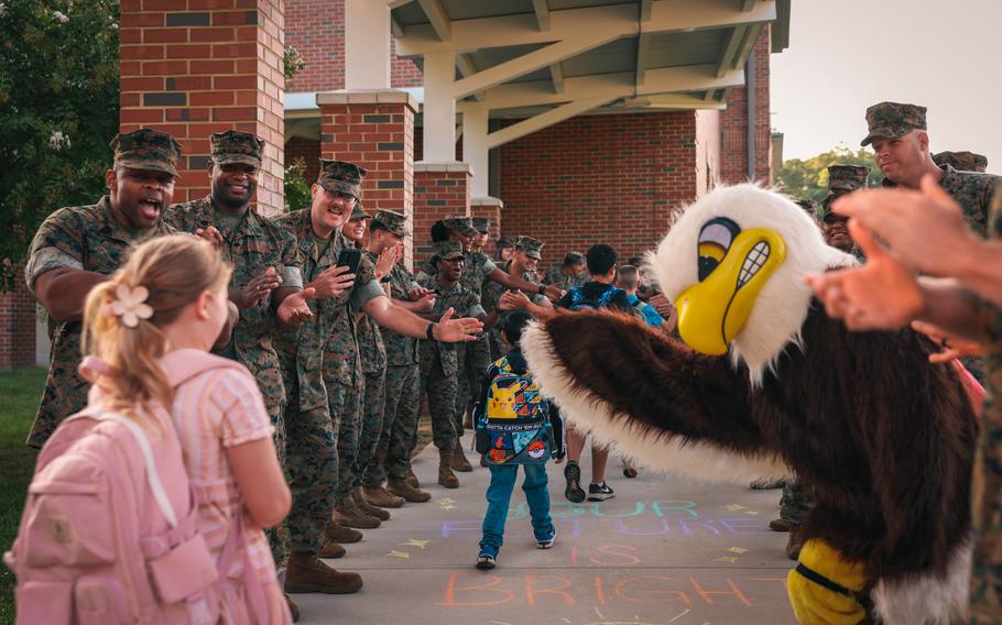 Students are greeted by U.S. Marines during a back-to-school celebration at the Crossroads Elementary School on Marine Corps Base Quantico, Va., Aug. 21, 2024. 