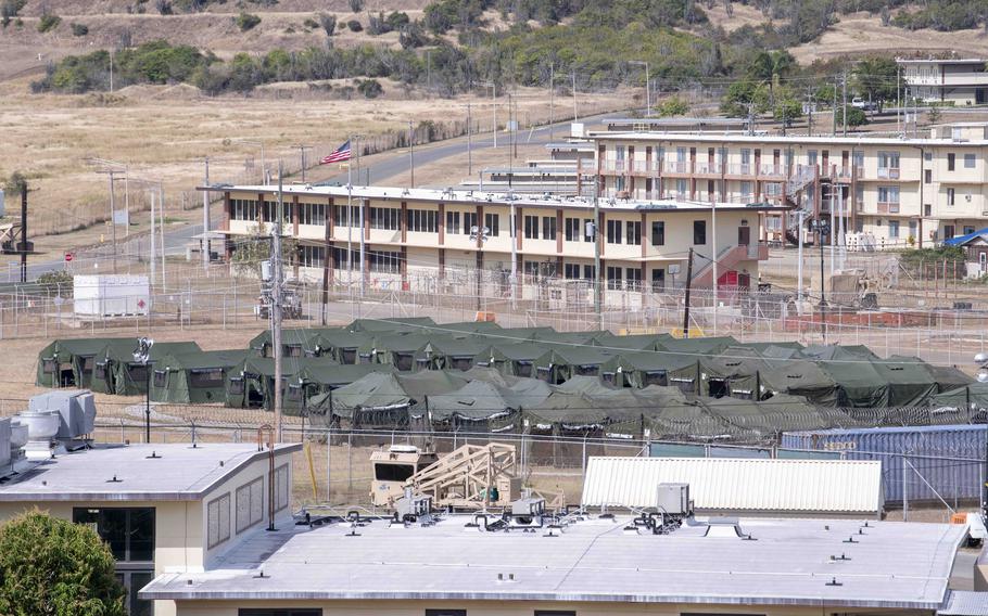 Long distance view of green tents at Guantanamo.