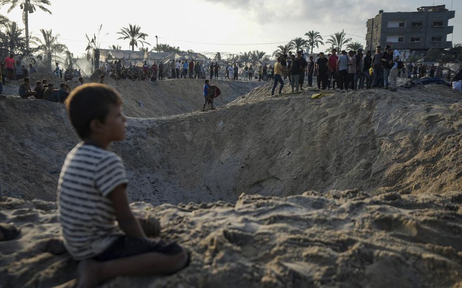 Palestinians survey the aftermath of an Israeli airstrike on a crowded tent camp in Muwasi, Gaza Strip, on Sept. 10, 2024.