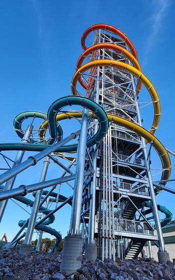 The Rise of Icarus tower features one 145-foot-tall waterslide starting at the top and four 60-foot-tall slides (in blue/green). 