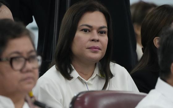 Philippine Vice President Sara Duterte listens as she attends a joint committee hearing of the House of Representatives in Quezon City, Philippines on Wednesday, Nov. 13, 2024, investigating the war on drugs during the administration of his father former President Rodrigo Duterte. (AP Photo/Aaron Favila)