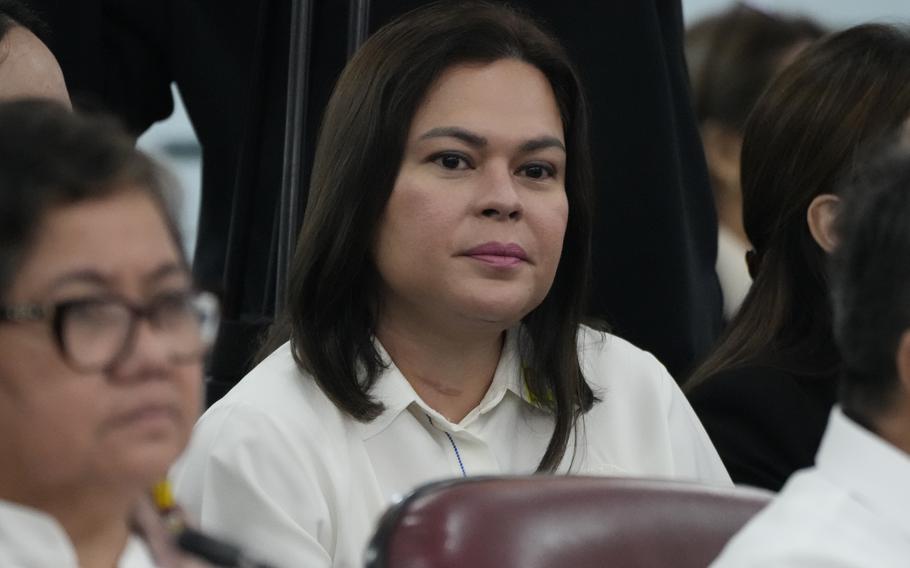 Philippine Vice President Sara Duterte listens as she attends a joint committee hearing of the House of Representatives in Quezon City, Philippines on Wednesday, Nov. 13, 2024, investigating the war on drugs during the administration of his father former President Rodrigo Duterte. 