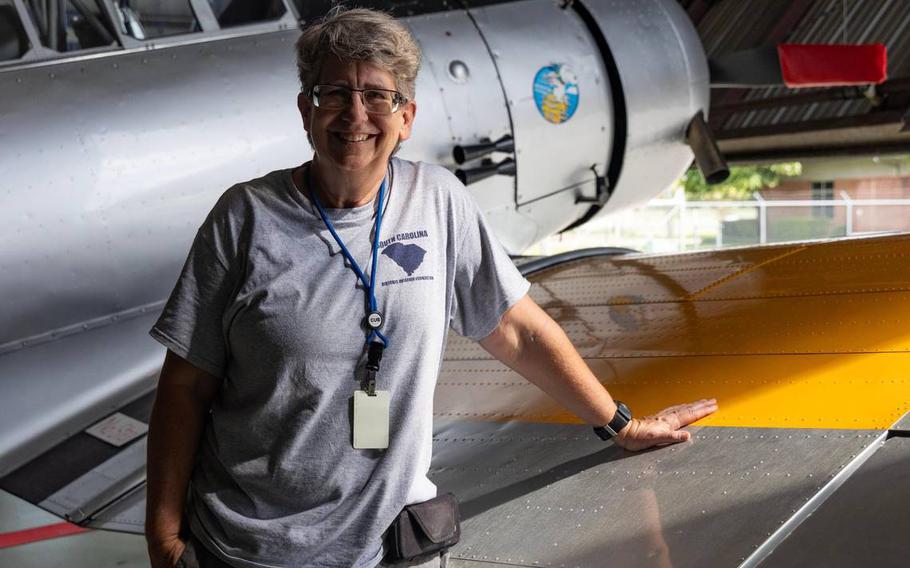 Katherine Cuddy shows a restored B-25C at Owens Field Airport on Monday, Aug. 7, 2023. Cuddy attended an open house at the hangar and decided to volunteer and help with the restoration.