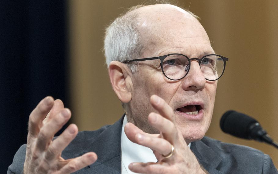 VA official uses his hands as he talks at a House hearing.