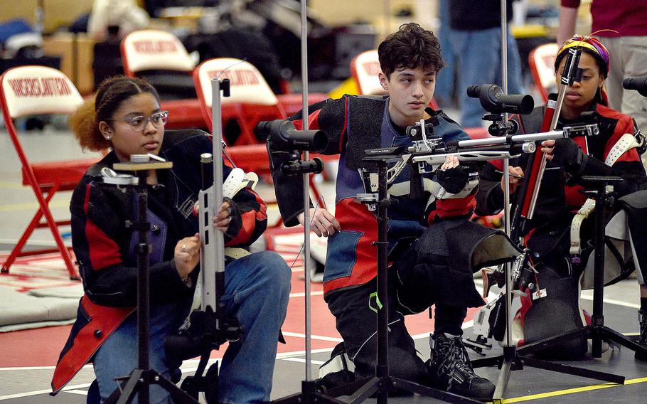 Ramstein Royals May Henry, left, and Mateo Cardenas adjust their equipment during a marksmanship competition on Jan. 6, 2024, at Kaiserslautern High School in Kaiserslautern, Germany.