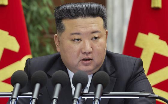 North Korean leader Kim Jong Un delivers a speech at a meeting.