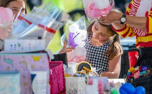 A girl receives a balloon animal