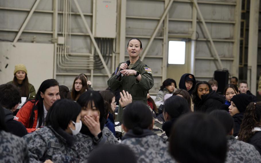 Lt. Col. Kira Coffey, commander of the 36th Airlift Squadron, answers students' questions during a Fly Girls event at Yokota Air Base, Japan, on March 8, 2024. 